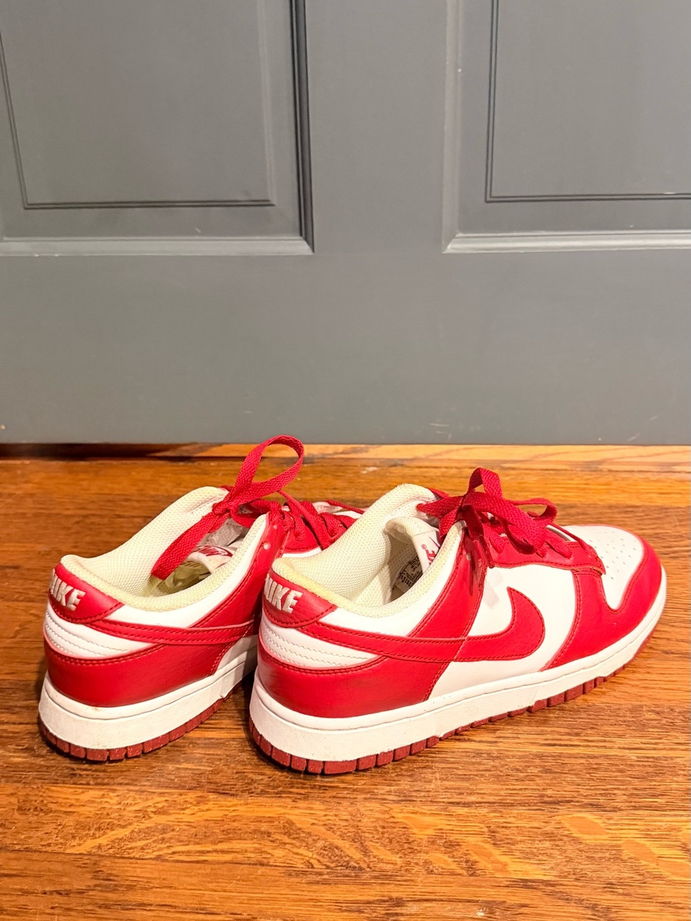 Nike Kids Red and White Low-Top Sneakers with Classic Swoosh